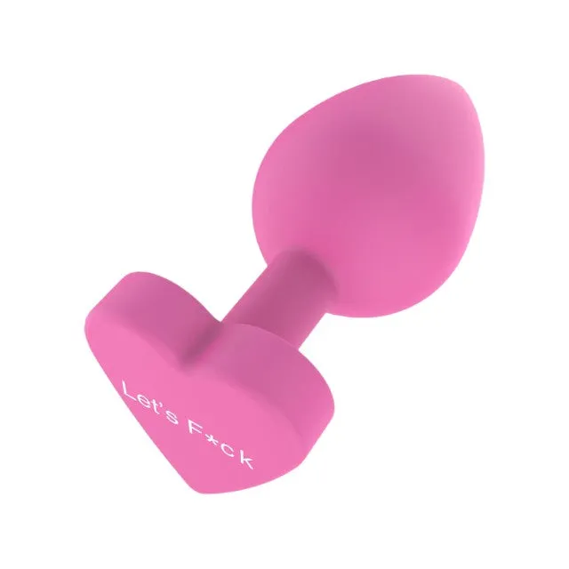 Plug anal TOYJOY Anal Play Booty Sweethearts. cu mesaj „Let's Fuck pe baza în formă de inimă. diametru 3.5 cm. roz