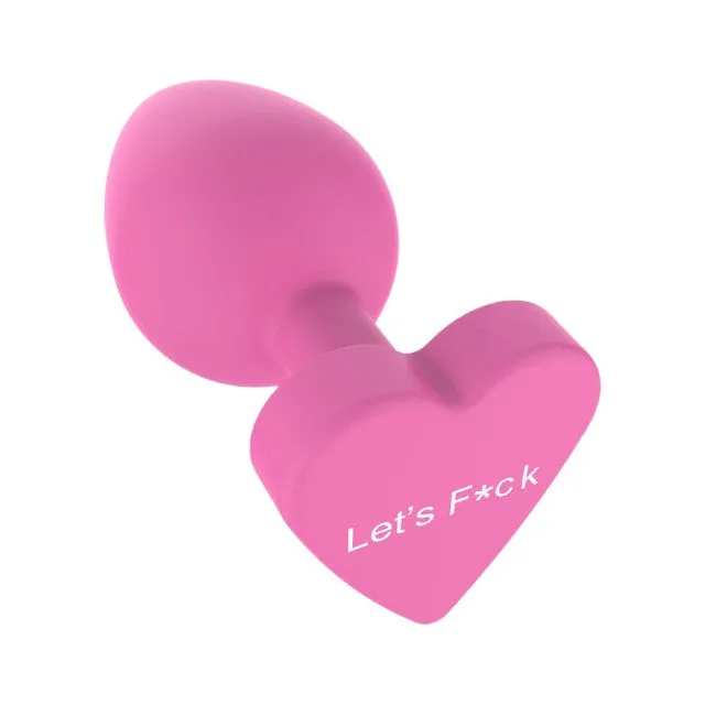 Plug anal TOYJOY Anal Play Booty Sweethearts. cu mesaj „Let's Fuck pe baza în formă de inimă. diametru 3.5 cm. roz